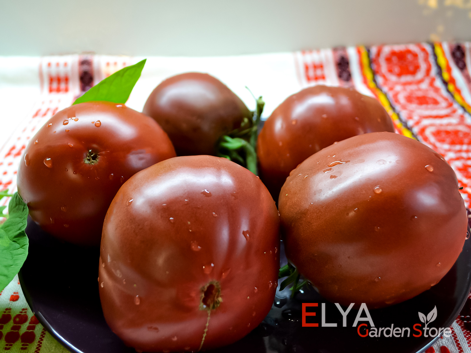 Томат Бычок Черный - один из самых вкусных темноплодных сортов - фото магазина семян Elya Garden  